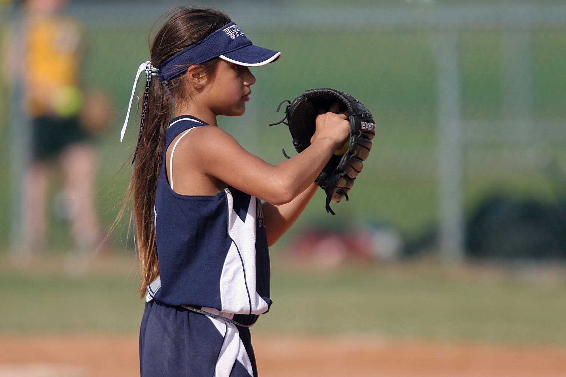 girl playing baseball