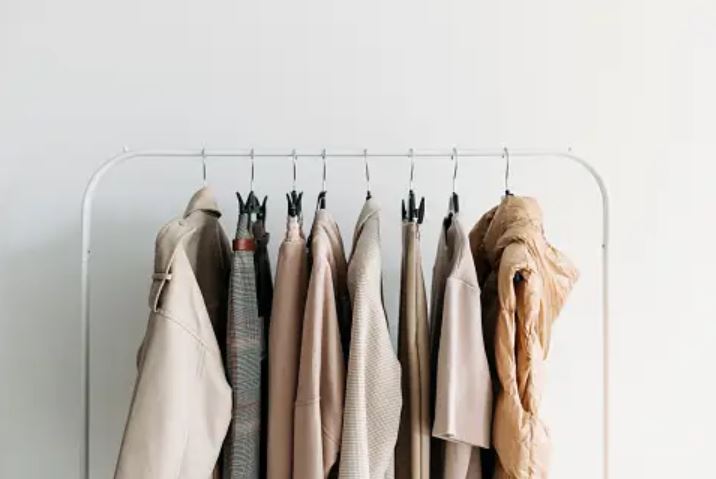 Neutral clothes on hangers