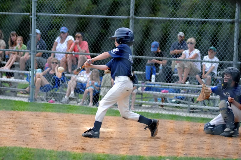 Young baseball player batting